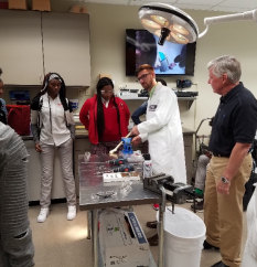 Scientist demonstrates to students at YLC Power Ties