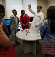 Scientist talking to students at YLC Power Ties